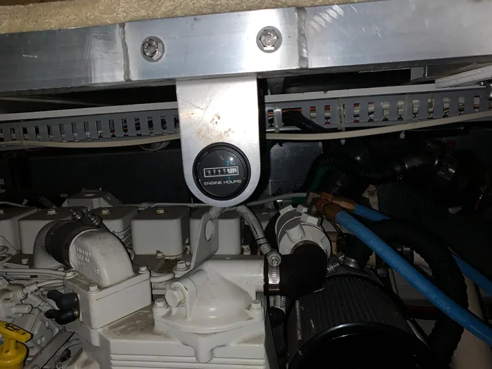 Why Knot Yacht Photos Pics Engine room of 2001 Carver 396 Motor Yacht with visible components and wiring.