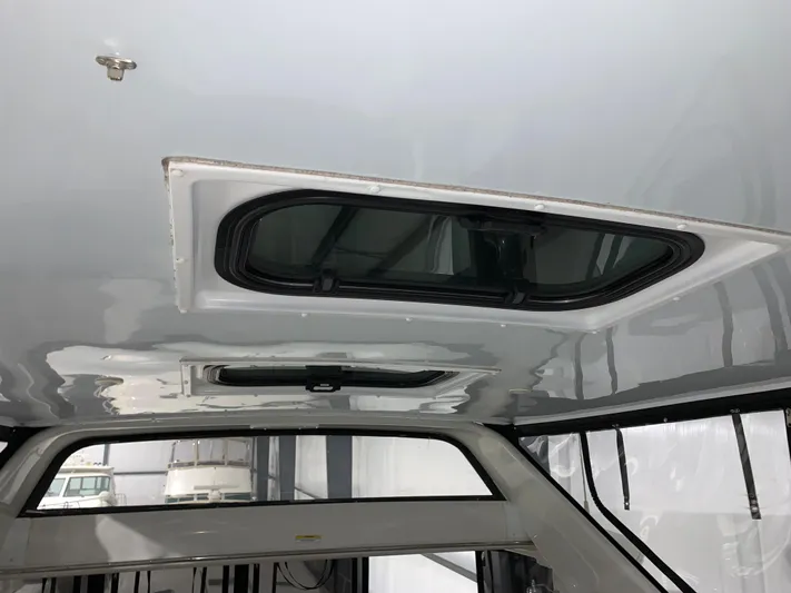 Why Knot Yacht Photos Pics Ceiling view of 2001 Carver 396 Motor Yacht with open hatch window.