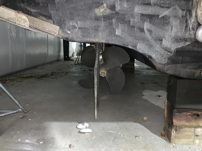 Why Knot Yacht Photos Pics Propeller of 2001 Carver 396 Motor Yacht in dry dock, showing underside details.