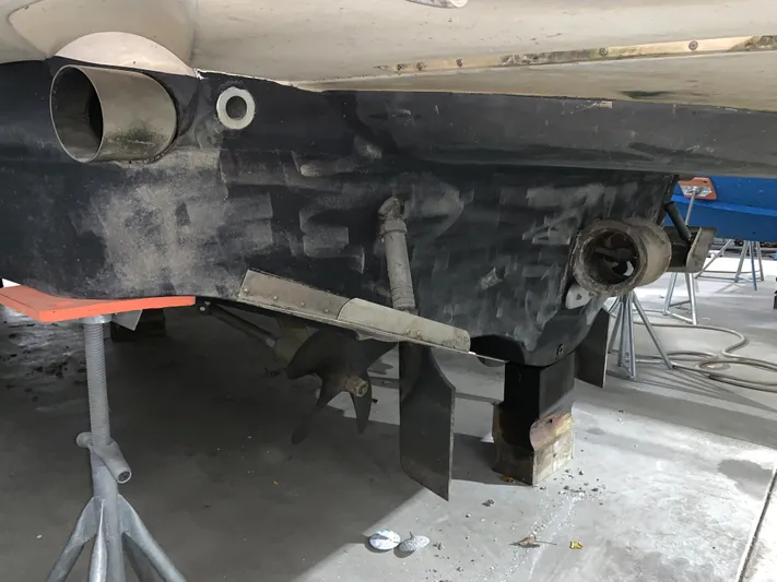 Why Knot Yacht Photos Pics 2001 Carver 396 Motor Yacht under maintenance, showing hull and propeller details.