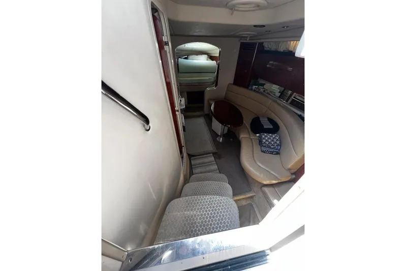 Wet Mess Yacht Photos Pics Interior of 2004 Sea Ray 360 Sundancer yacht with seating and table.