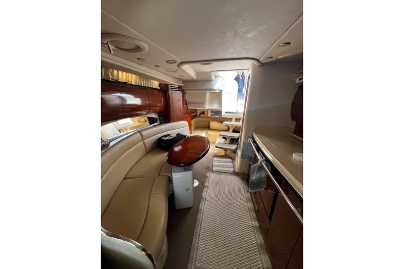 Wet Mess Yacht Photos Pics Luxurious interior of 2004 Sea Ray 360 Sundancer yacht with elegant seating and dining area.