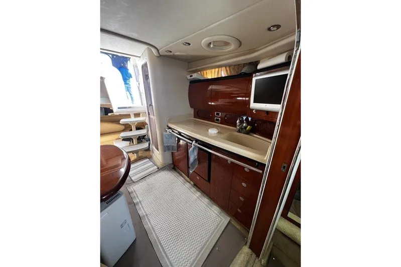 Wet Mess Yacht Photos Pics Interior of 2004 Sea Ray 360 Sundancer yacht with modern kitchen amenities.