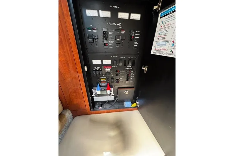 Wet Mess Yacht Photos Pics Electrical panel of a 2004 Sea Ray 360 Sundancer boat, featuring various switches and controls.