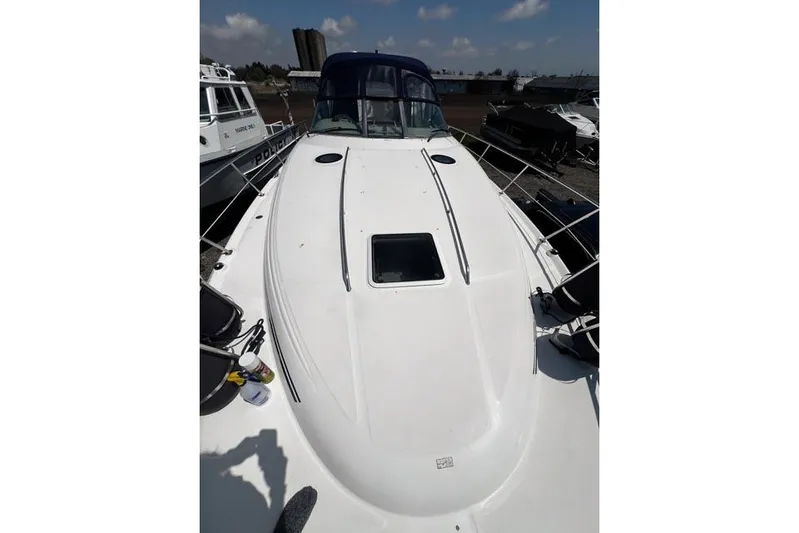 Wet Mess Yacht Photos Pics 2004 Sea Ray 360 Sundancer boat deck under clear sky, docked with other vessels.