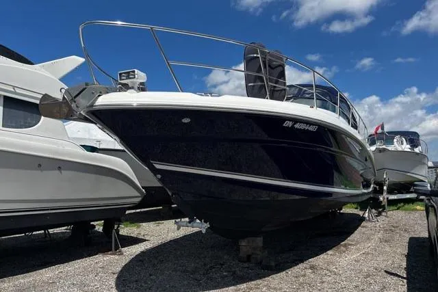 Wet Mess Yacht Photos Pics 2004 Sea Ray 360 Sundancer boat on display under a clear blue sky.