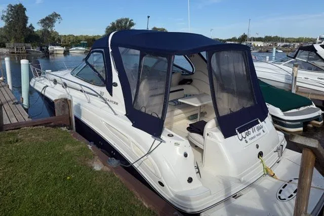 Wet Mess Yacht Photos Pics 2004 Sea Ray 360 Sundancer docked at marina with blue canopy.