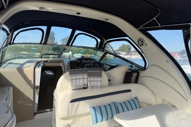 Wet Mess Yacht Photos Pics Interior of 2004 Sea Ray 360 Sundancer yacht with plush seating and panoramic windows.