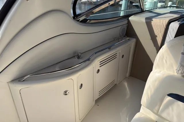 Wet Mess Yacht Photos Pics 2004 Sea Ray 360 Sundancer interior with sleek cabinetry and seating.