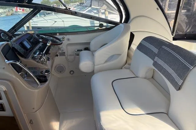 Wet Mess Yacht Photos Pics 2004 Sea Ray 360 Sundancer cockpit with plush seating and modern controls.