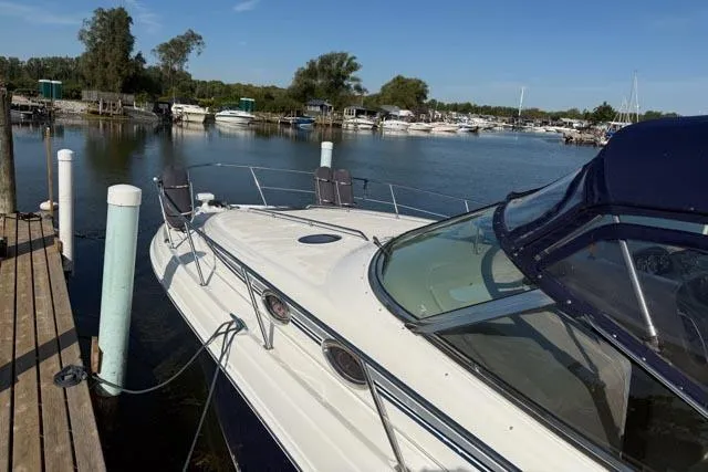 Wet Mess Yacht Photos Pics 2004 Sea Ray 360 Sundancer docked at a serene marina with clear blue skies.