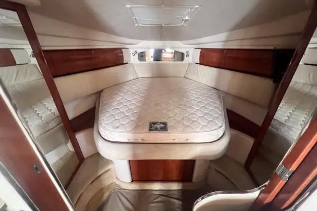 Wet Mess Yacht Photos Pics Interior cabin of 2004 Sea Ray 360 Sundancer with a comfortable bed.