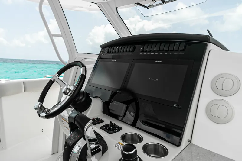 2019 Boston Whaler 350 Realm @ Cancun Yacht Photos Pics 2019 Boston Whaler 350 Realm helm with modern controls and ocean view.