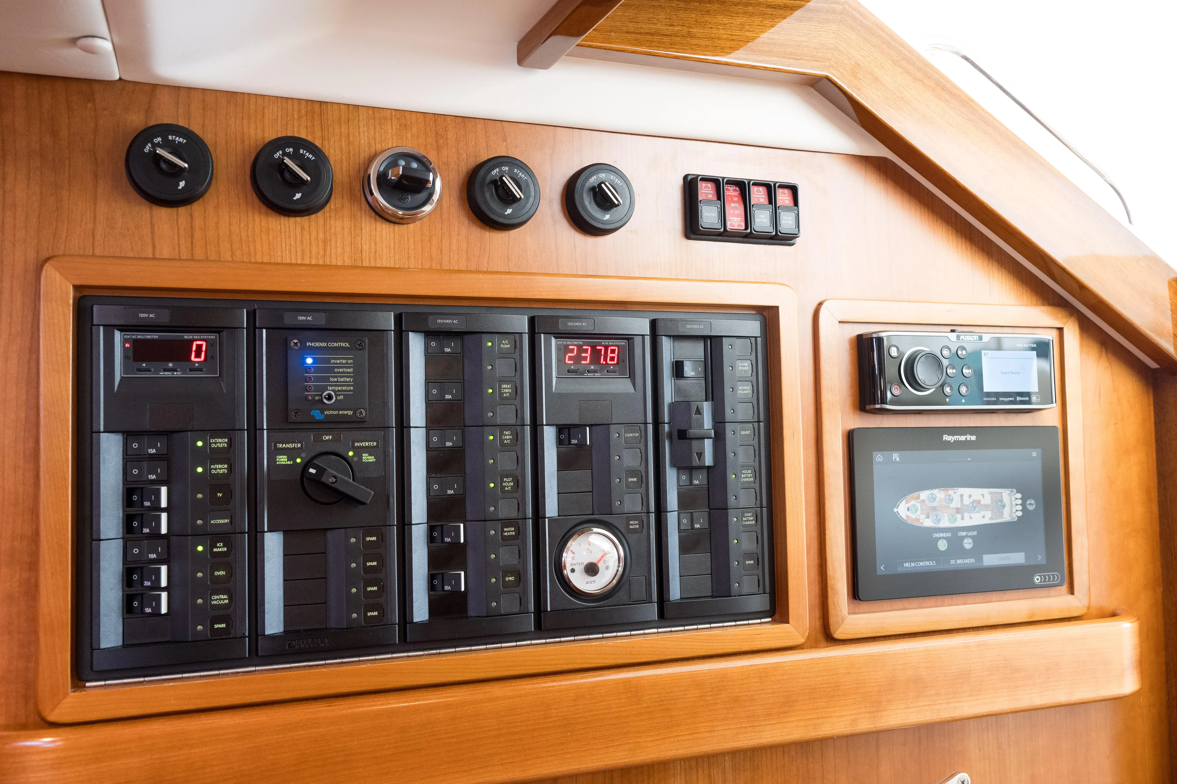 Dayglow Yacht Photos Pics Control panel of 2020 MJM 53z yacht with gauges, switches, and navigation display.