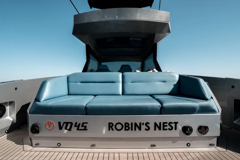 Robin's Nest Yacht Photos Pics 2023 Vanquish Yachts VQ45 Veloce Hardtop with blue seating, "Robin's Nest" branding.
