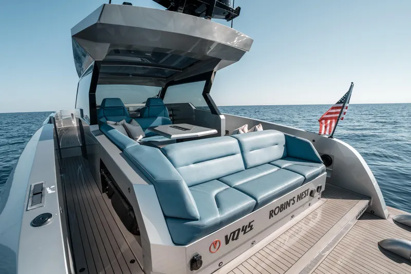 Robin's Nest Yacht Photos Pics 2023 Vanquish Yachts VQ45 Veloce Hardtop on open sea, featuring luxurious seating.