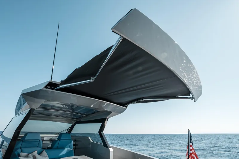 Robin's Nest Yacht Photos Pics 2023 Vanquish Yachts VQ45 Veloce Hardtop with open sunroof on the ocean.