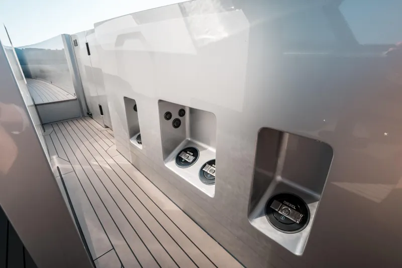 Robin's Nest Yacht Photos Pics 2023 Vanquish Yachts VQ45 Veloce Hardtop deck with sleek design and fuel access points.