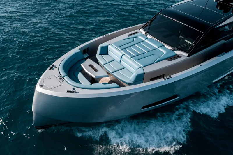 Robin's Nest Yacht Photos Pics 2023 Vanquish Yachts VQ45 Veloce Hardtop cruising on open water, featuring sleek design and luxury seating.