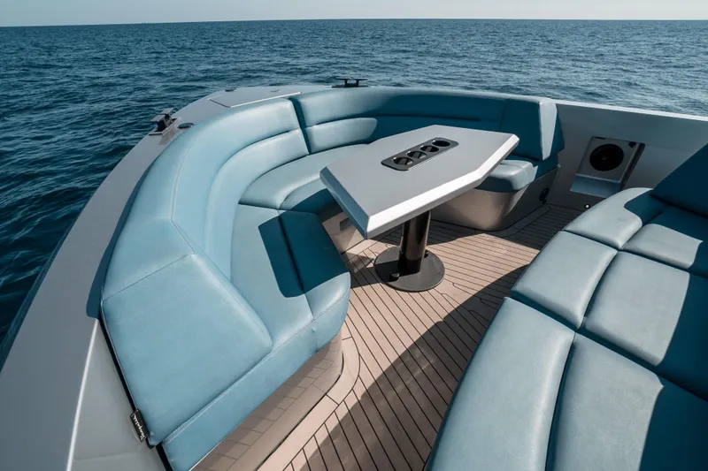 Robin's Nest Yacht Photos Pics Luxurious seating area on 2023 Vanquish Yachts VQ45 Veloce Hardtop, overlooking the ocean.