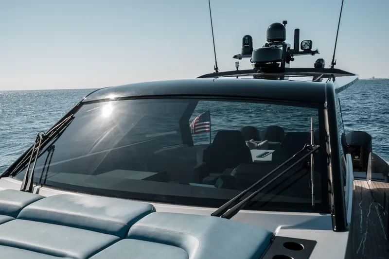 Robin's Nest Yacht Photos Pics 2023 Vanquish Yachts VQ45 Veloce Hardtop cruising on open water.