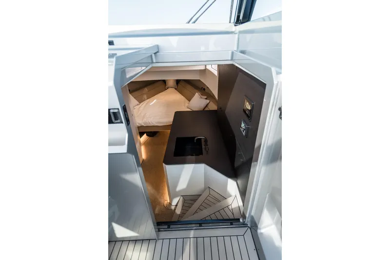 Robin's Nest Yacht Photos Pics Interior view of 2023 Vanquish Yachts VQ45 Veloce Hardtop, featuring modern cabin design.