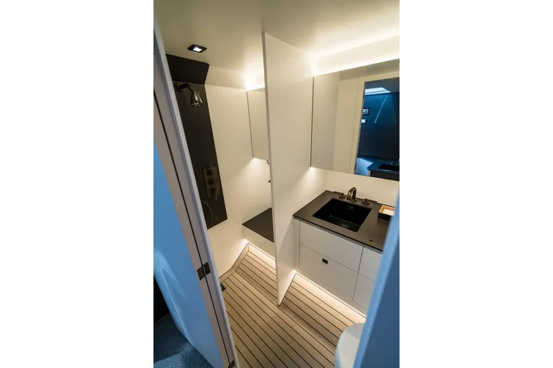 Robin's Nest Yacht Photos Pics Luxurious bathroom interior of 2023 Vanquish Yachts VQ45 Veloce Hardtop.