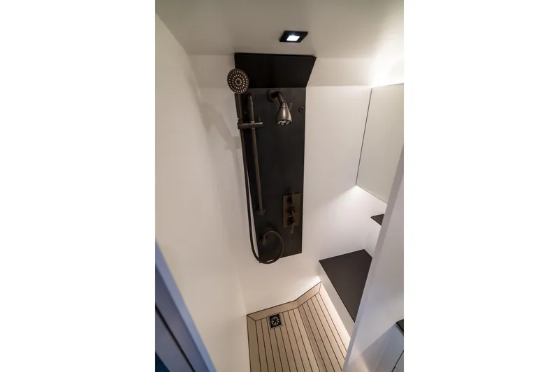 Robin's Nest Yacht Photos Pics Shower area in 2023 Vanquish Yachts VQ45 Veloce Hardtop, featuring modern fixtures and sleek design.