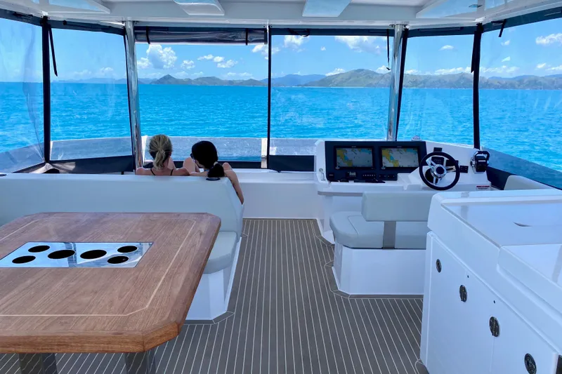  Yacht Photos Pics Interior of 2022 Leopard 46 Powercat yacht with ocean view and navigation equipment.