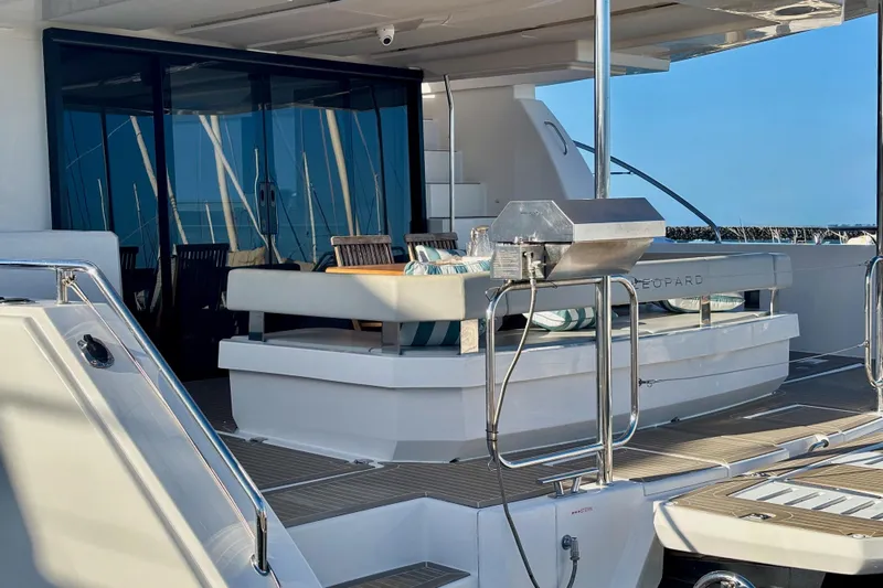  Yacht Photos Pics 2022 Leopard 46 Powercat yacht deck with seating and grill.