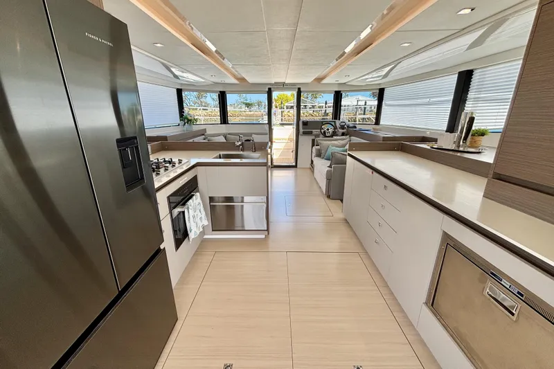  Yacht Photos Pics Luxurious interior of 2022 Leopard 46 Powercat yacht with modern kitchen and spacious seating area.