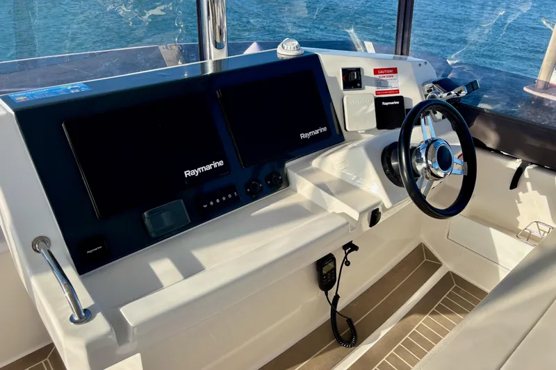  Yacht Photos Pics Helm of 2022 Leopard 46 Powercat with Raymarine navigation system and steering wheel.