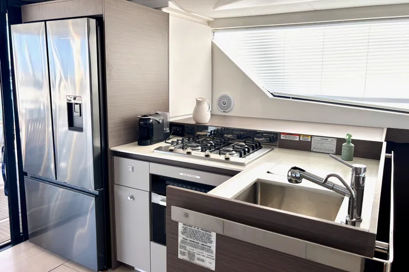 Yacht Photos Pics Modern kitchen in 2022 Leopard 46 Powercat yacht with stainless steel appliances.