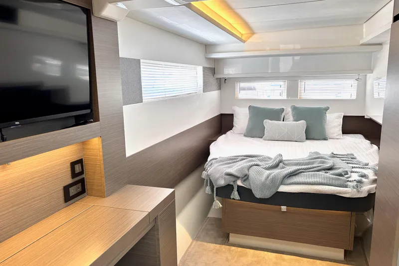  Yacht Photos Pics Luxurious bedroom interior of 2022 Leopard 46 Powercat with cozy bed and modern decor.