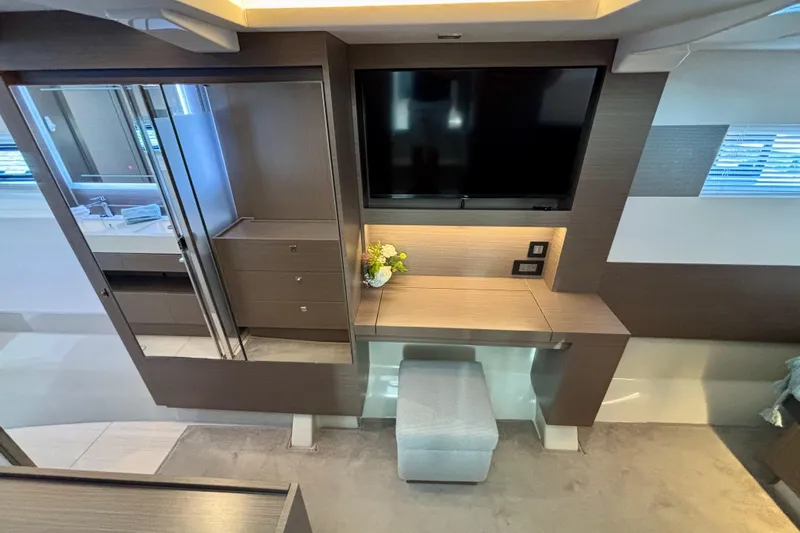  Yacht Photos Pics Luxurious interior of 2022 Leopard 46 Powercat with TV, desk, and modern decor.