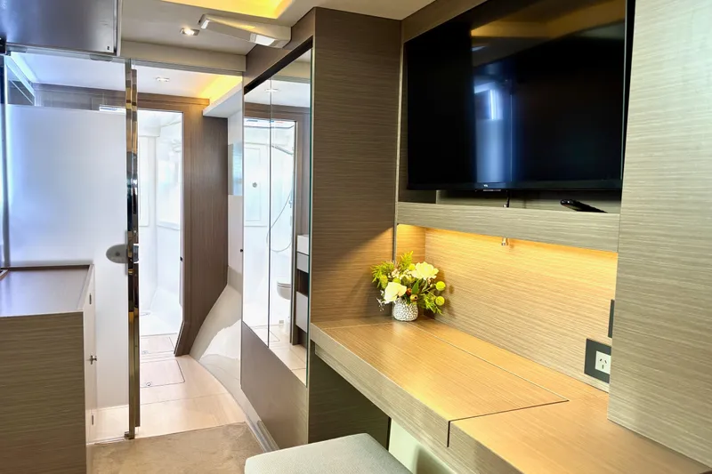  Yacht Photos Pics Modern interior of 2022 Leopard 46 Powercat yacht with TV and desk area.