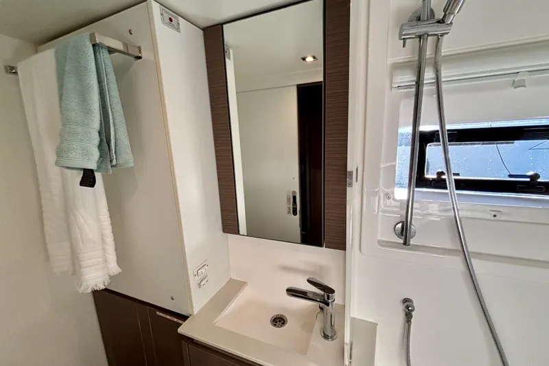  Yacht Photos Pics Modern bathroom in 2022 Leopard 46 Powercat with sleek fixtures and mirror.