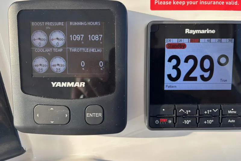  Yacht Photos Pics Yanmar and Raymarine displays on a 2022 Leopard 46 Powercat, showing engine data and compass heading.