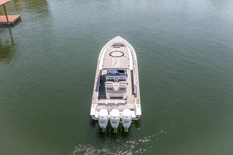  Yacht Photos Pics 2023 Fountain 38 SC boat on water, rear view with triple engines.