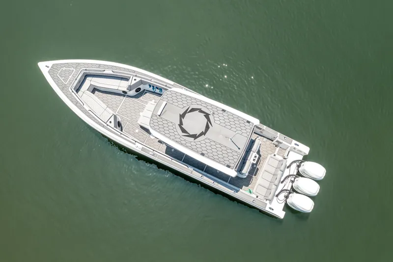  Yacht Photos Pics Aerial view of 2023 Fountain 38 SC boat on calm water.