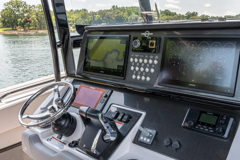  Yacht Photos Pics 2023 Fountain 38 SC boat dashboard with advanced navigation and control systems.