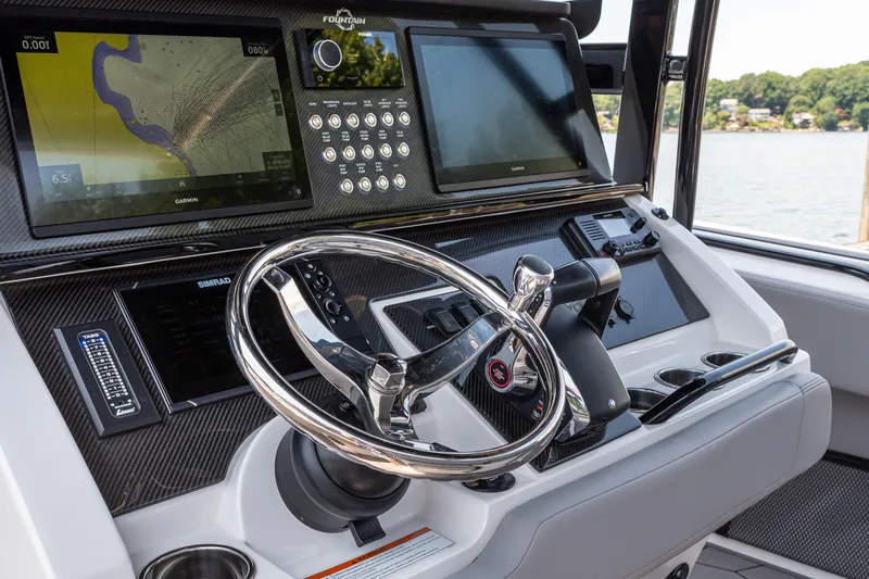  Yacht Photos Pics 2023 Fountain 38 SC boat dashboard with advanced navigation and control systems.