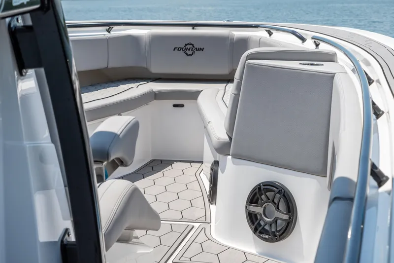  Yacht Photos Pics 2023 Fountain 38 SC boat interior with seating and speaker, featuring modern design.