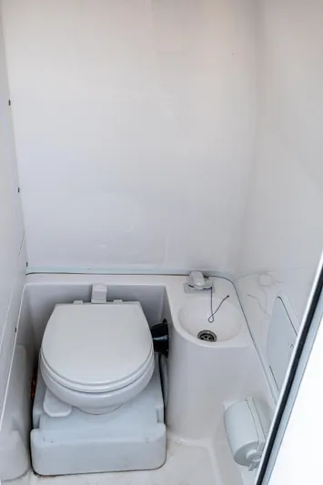  Yacht Photos Pics 2023 Fountain 38 SC boat bathroom with toilet and sink.