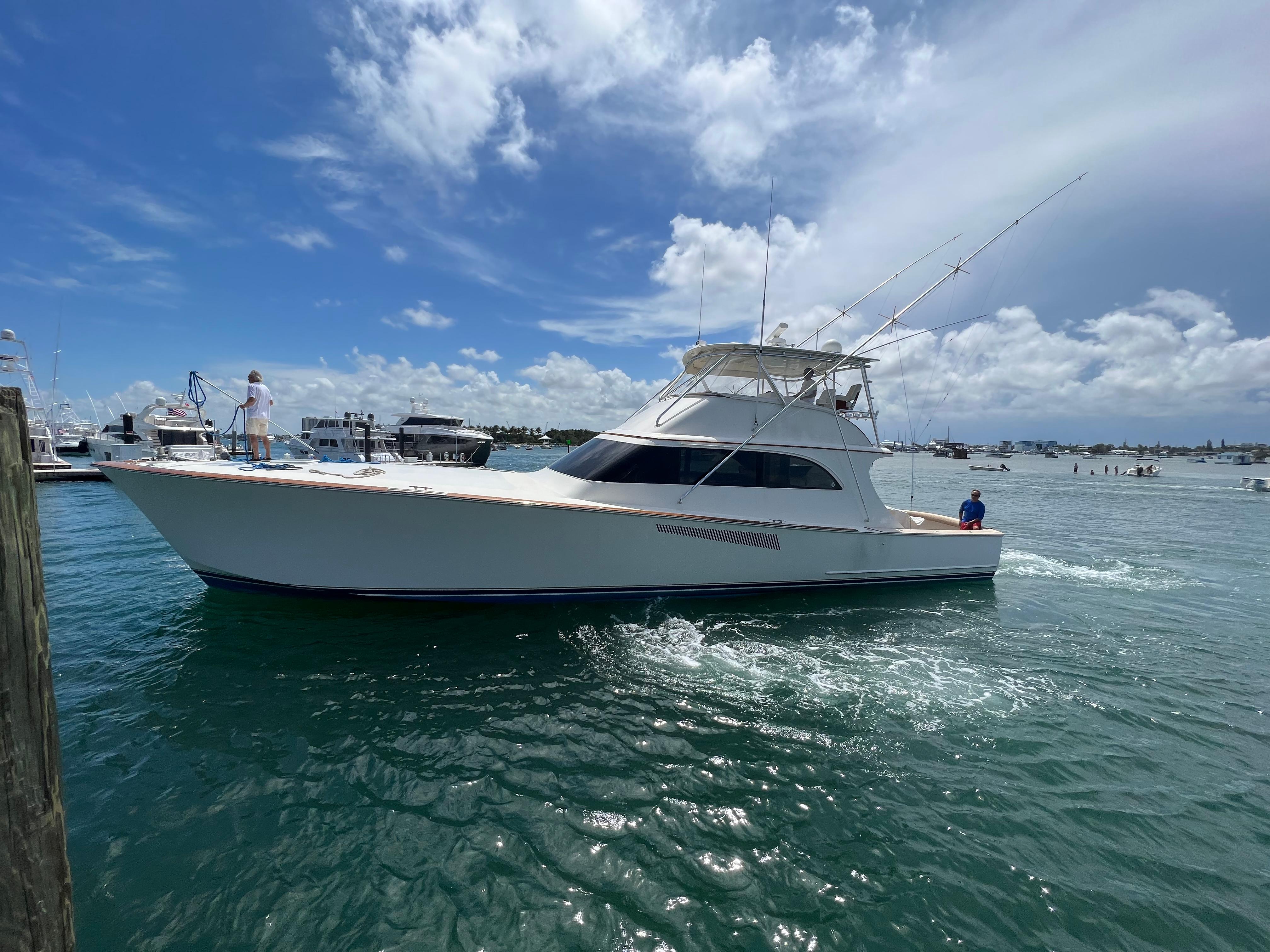 1999 Hines-Farley Sportfisherman yacht cruising on a sunny day.