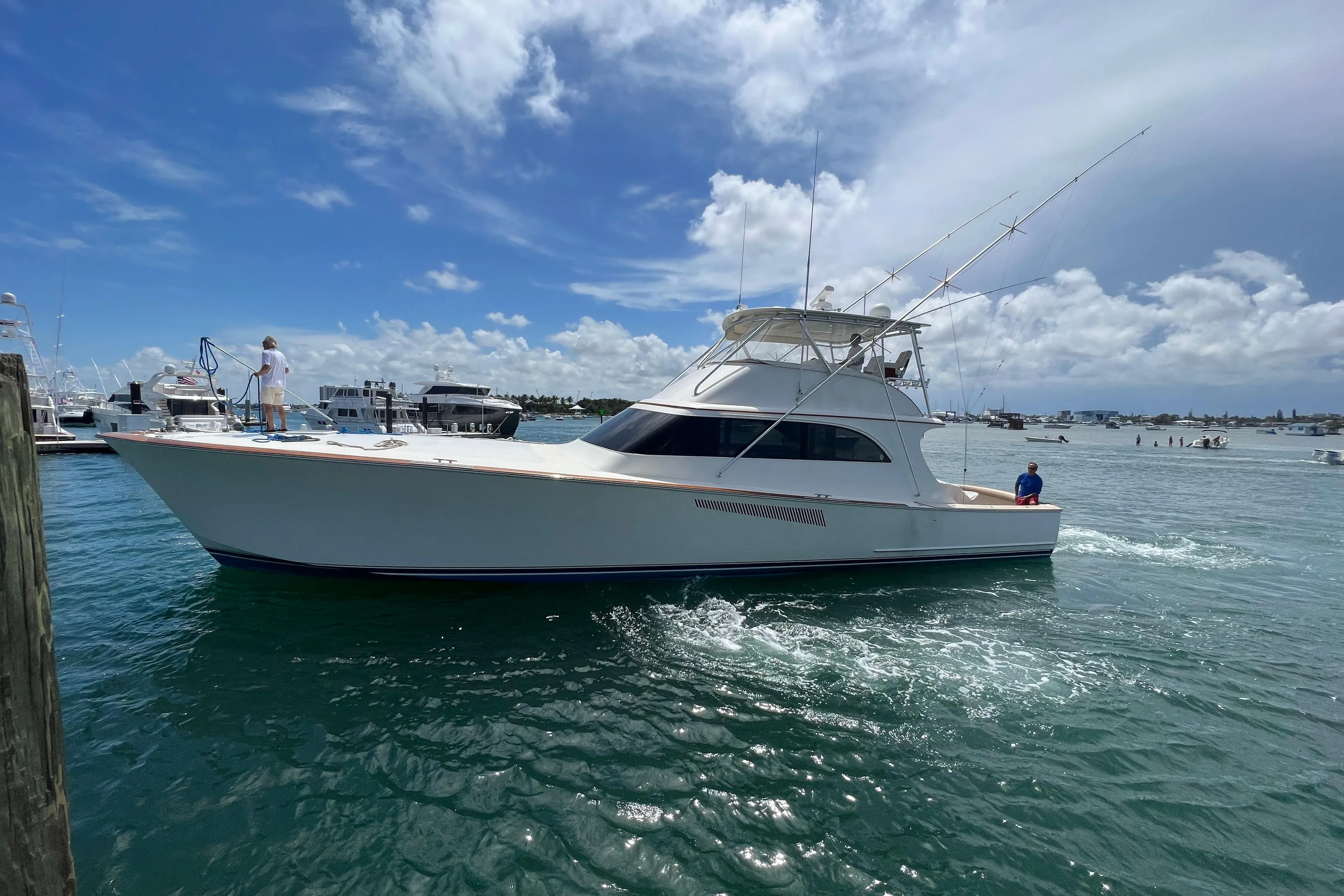 1999 Hines-Farley Sportfisherman yacht cruising on a sunny day.