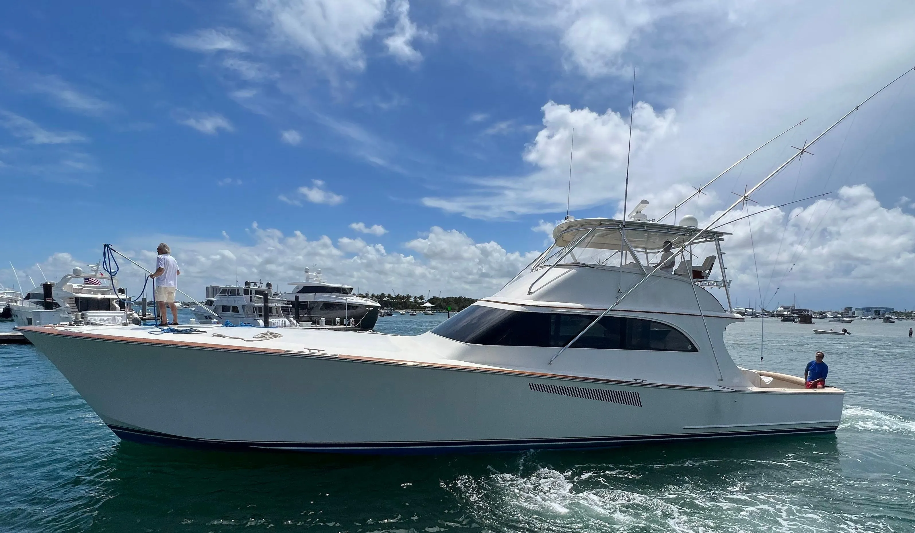 1999 Hines-Farley SPORTFISHERMAN yacht cruising on a sunny day with clear skies.