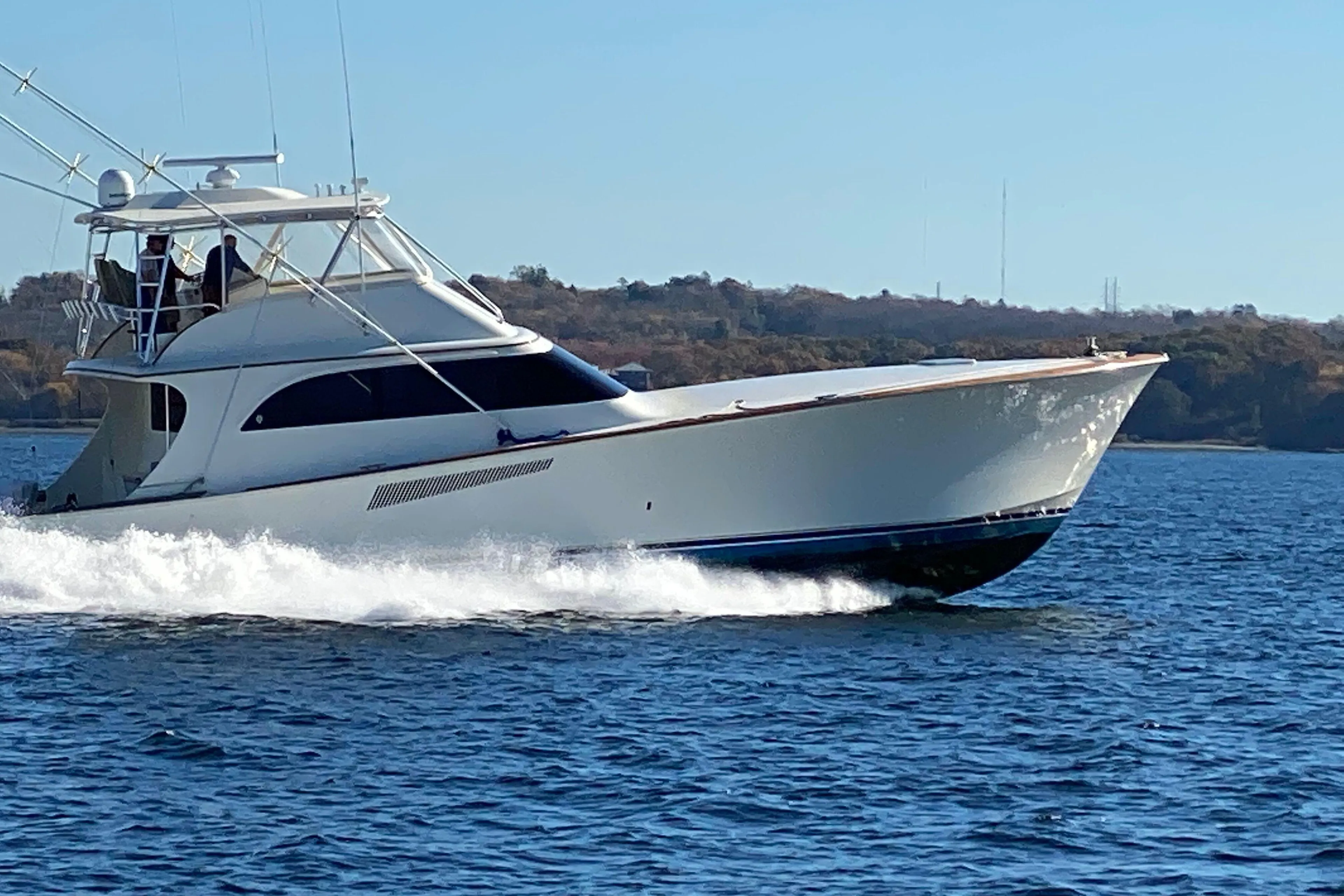 1999 Hines-Farley SPORTFISHERMAN yacht cruising on open water.