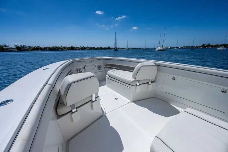  Yacht Photos Pics 2013 Jupiter 34 boat interior with white seating, on a sunny day by the water.