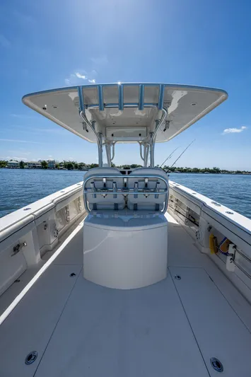  Yacht Photos Pics 2013 Jupiter 34 boat interior with seating, under a clear blue sky on calm water.